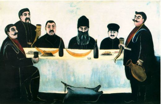 pięciu mężczyzn z wąsami siedzi przy białym stole obraz Niko Pirosmaniego